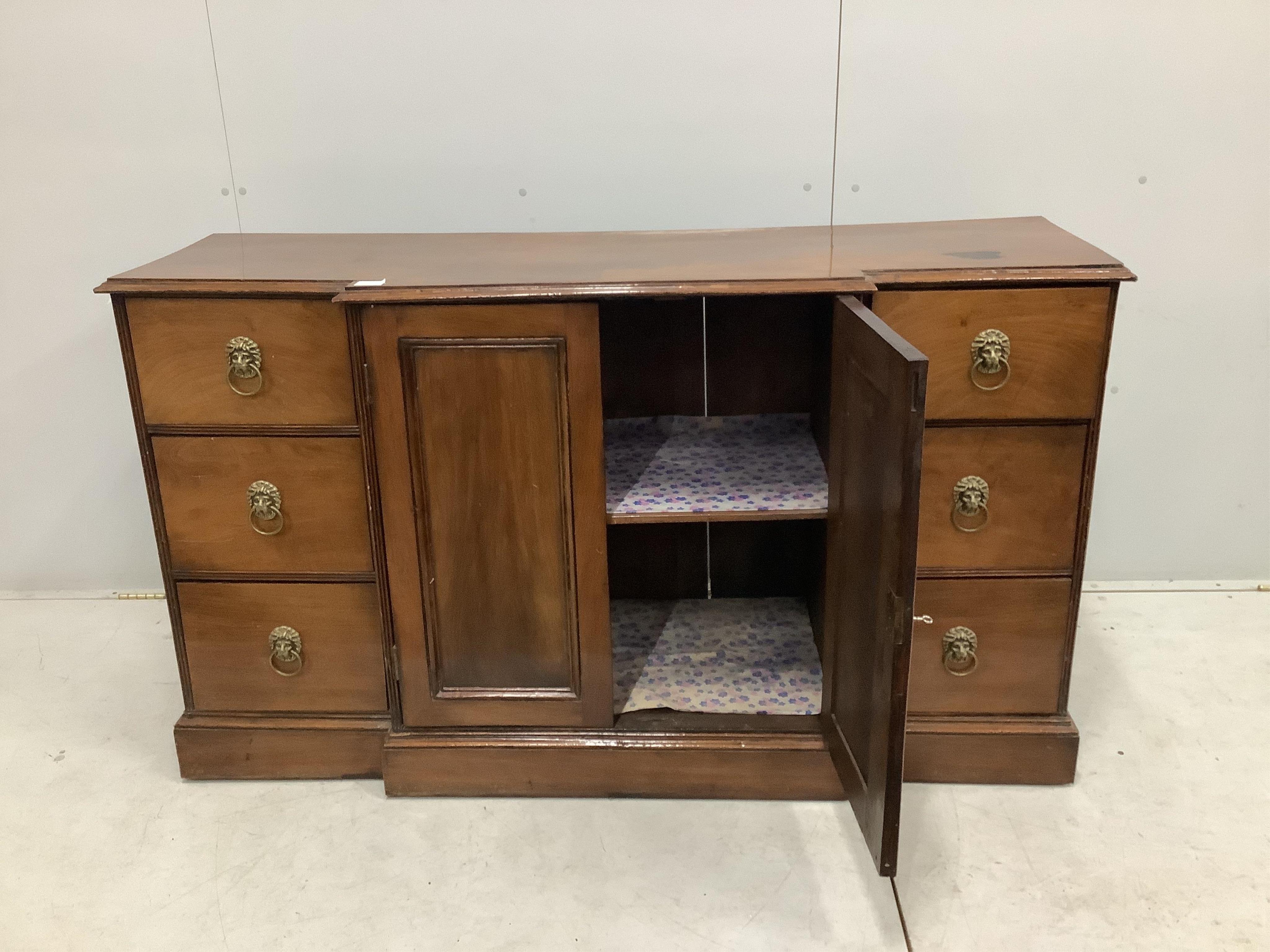 A George IV style mahogany breakfront dwarf cabinet, width 152cm, depth 49cm, height 87cm. Condition - fair, top has a large dark blemish